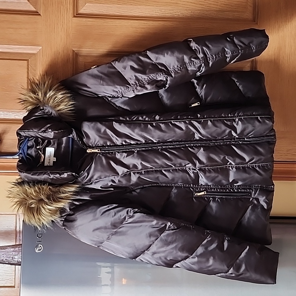 Size 1X dark brown Calvin Klein coat with removable furry hood.